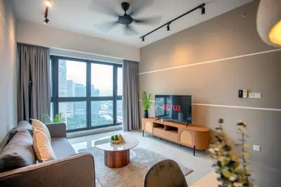 a living room with a couch and a tv at Agile Bukit Bintang TRX KL City by Cobnb in Kuala Lumpur