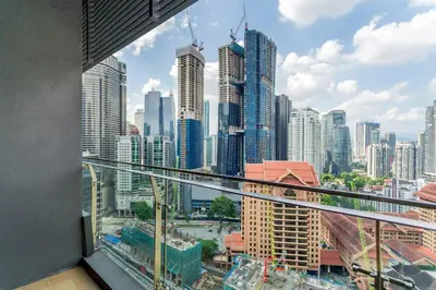 a view of a city skyline from a balcony at Dorsett Bukit Bintang near Pavilion KL, Kuala Lumpur in Kuala Lumpur
