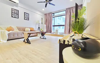 a living room with a black vase on a table at The Meow Loft Fahrenheit Bukit Bintang Kuala Lumpur - Pavilion - KLCC in Kuala Lumpur