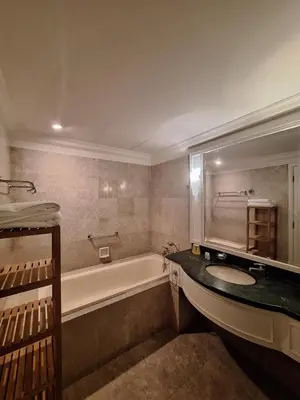 a bathroom with a bath tub and a sink at Midtown Suite At Times Square Hotel KL in Kuala Lumpur