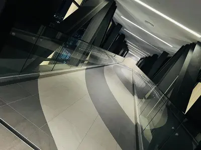 a lobby with a glass table and chairs at Axon suites bukit bintang Klcc by Aura in Kuala Lumpur