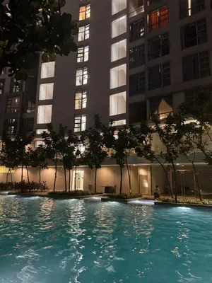 a swimming pool in front of some tall buildings at PARKVIEW RESIDENCE KLCC By IKNAS SUITES in Kuala Lumpur