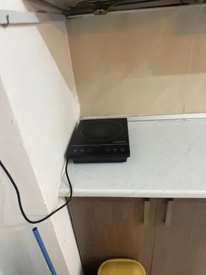 a black appliance sitting on top of a counter at PARKVIEW RESIDENCE KLCC By IKNAS SUITES in Kuala Lumpur