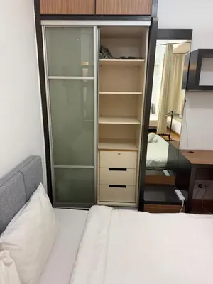 a bedroom with a bed and a closet and a desk at PARKVIEW RESIDENCE KLCC By IKNAS SUITES in Kuala Lumpur