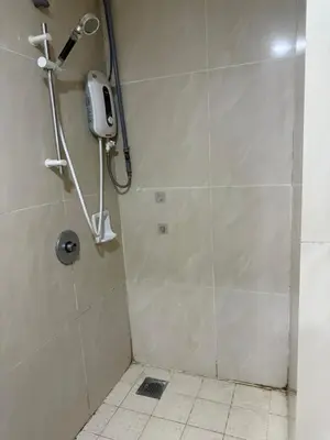 a shower stall with a phone on the wall at PARKVIEW RESIDENCE KLCC By IKNAS SUITES in Kuala Lumpur
