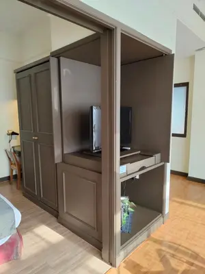 a living room with a closet with a tv and a tv at Visitor Suites At Times Square Kuala Lumpur in Kuala Lumpur