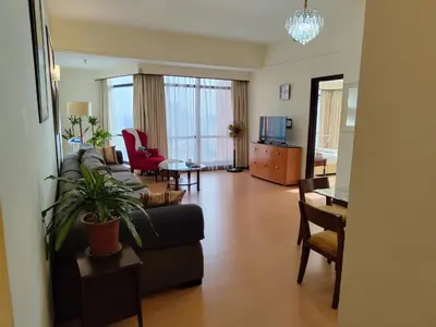 a living room with a couch and a table at Visitor Suites At Times Square Kuala Lumpur in Kuala Lumpur