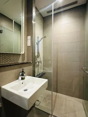a bathroom with a sink and a shower at Lucentia Infinity Pool Suit Kuala Lumpur in Kuala Lumpur