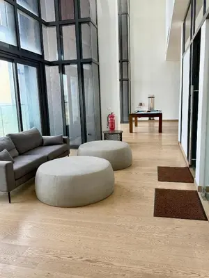 a large living room with a couch and a table at Lucentia Infinity Pool Suit Kuala Lumpur in Kuala Lumpur