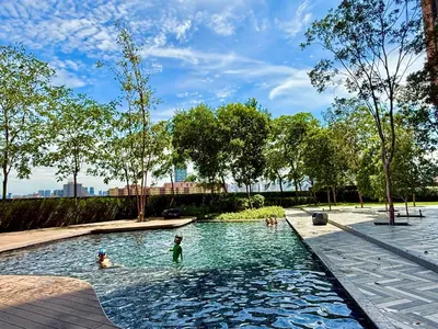a group of children playing in a swimming pool at a park at Lucentia Infinity Pool Suit Kuala Lumpur in Kuala Lumpur