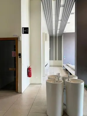 a bathroom with two sinks in a building at Lucentia Infinity Pool Suit Kuala Lumpur in Kuala Lumpur