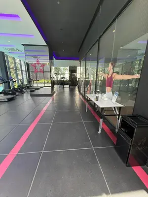a woman standing in the middle of a building at Star Residences One klcc in Kuala Lumpur