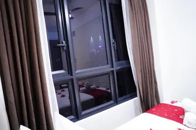 a room with a window with a view of the city at Agile Kuala Lumpur City Centre By AMG in Kuala Lumpur
