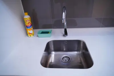 a kitchen sink with a faucet on a counter at Agile Kuala Lumpur City Centre By AMG in Kuala Lumpur