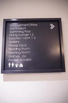 a black sign on a wall with words on it at Agile Kuala Lumpur City Centre By AMG in Kuala Lumpur