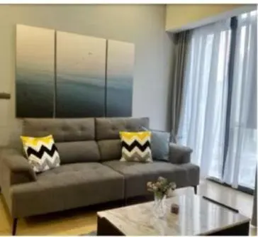 a living room with a couch and a coffee table at Star Residences One KLCC in Kuala Lumpur