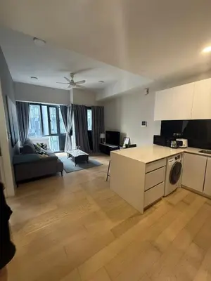a large kitchen and living room with a couch at Star Residences One KLCC in Kuala Lumpur