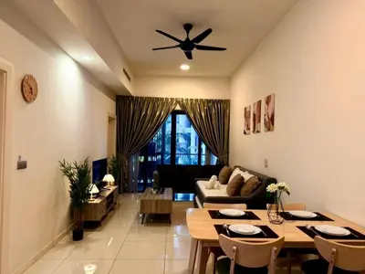 a living room with a table and a ceiling fan at Garden Balcony 2BR Home with Great Facilities and Parking in Kuala Lumpur