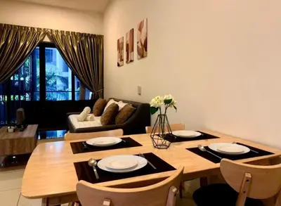 a living room with a wooden table with chairs at Garden Balcony 2BR Home with Great Facilities and Parking in Kuala Lumpur