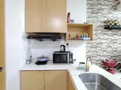 a kitchen with a microwave and a sink at KL studio with Private Jacuzzi in Kuala Lumpur