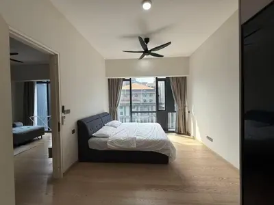 a bedroom with a bed and a ceiling fan at STAR Suites Residence KLCC in Kuala Lumpur