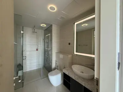 a bathroom with a sink and a toilet and a shower at Star Residences One KLCC in Kuala Lumpur