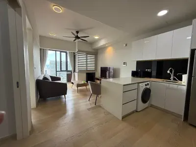 a kitchen and living room with a washer and dryer at Star Residences One KLCC in Kuala Lumpur