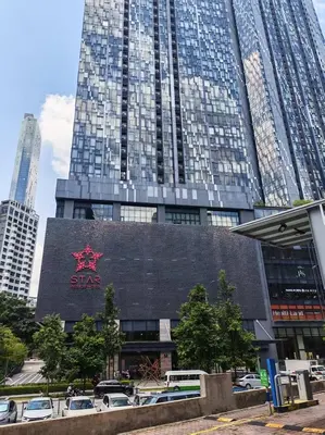 a building with a sas sign on it with tall buildings at Star Residences One KLCC in Kuala Lumpur