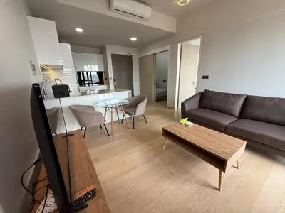 a living room with a couch and a table at Star Residences One KLCC in Kuala Lumpur