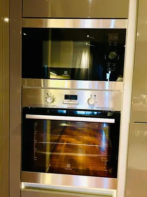 a stainless steel oven is in a kitchen at KLCC Service Suites at Mews in Kuala Lumpur