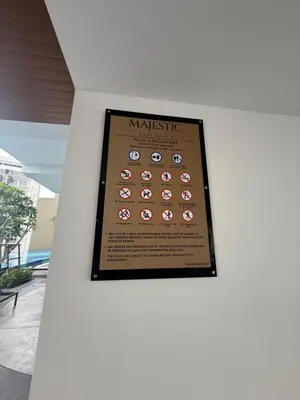 a poster on a wall with a picture of the nine clocks at Majestic Residence KLCC Sky view in Kuala Lumpur