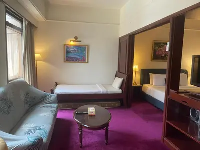 a hotel room with a couch and a tv at City view Apartment at Times square in Kuala Lumpur