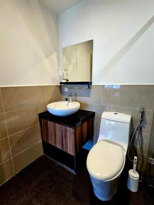 a bathroom with a white toilet and a sink at Metro Studio - Direct LRT access, near Pantai Hospital, University Malaya, Mid Valley, Bangsar in Kuala Lumpur