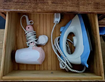 a wooden box with a toy phone at Metro Studio - Direct LRT access, near Pantai Hospital, University Malaya, Mid Valley, Bangsar in Kuala Lumpur