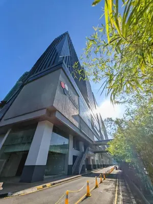 a building with a black roof on a street at Metro Studio - Direct LRT access, near Pantai Hospital, University Malaya, Mid Valley, Bangsar in Kuala Lumpur