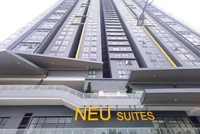 a tall building with a new suites sign in front of it at 2PAX-4PAX Projector Screen Stay near KLCC & Jelatek LRT Station in Kuala Lumpur