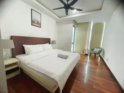 a bedroom with a bed and a ceiling fan at Casa Residency Apartment Bukit Bintang by Cupid home in Kuala Lumpur