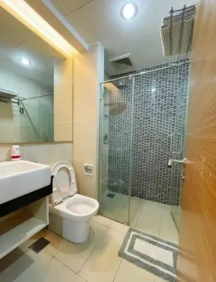 a bathroom with a shower and a toilet and a sink at Casa Residency Apartment Bukit Bintang by Cupid home in Kuala Lumpur