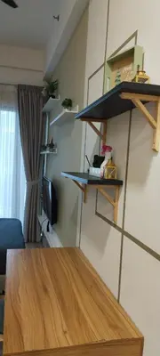a room with shelves and a wooden table at Sky Touch Homestay in Kuala Lumpur