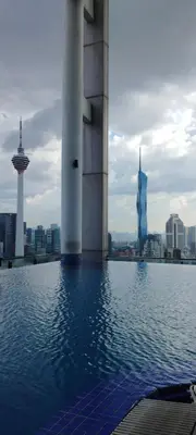 a view of a building with a city in the background at Sky Touch Homestay in Kuala Lumpur