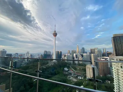 a view of auckland city with the sky needle at Ceylonz suites Klcc by StayLa in Kuala Lumpur