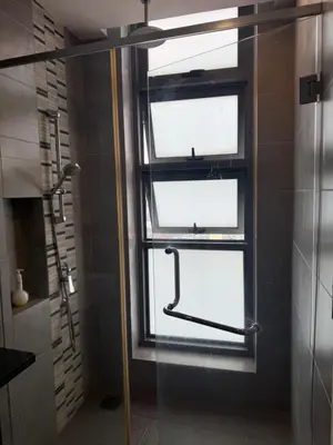 a bathroom with a shower and a window at Robertson Residence in Kuala Lumpur in Kuala Lumpur