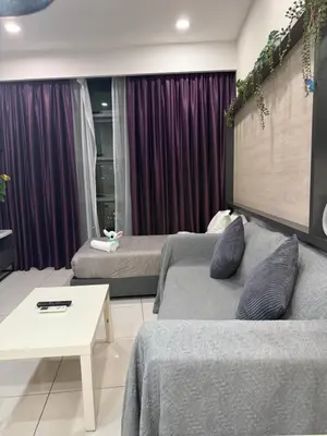 a living room with two beds and a couch at Robertson Residence in Kuala Lumpur in Kuala Lumpur