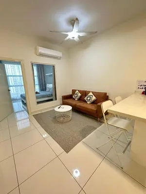 a living room with a couch and a table at Cosy Place in Kuala Lumpur