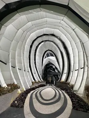 a tunnel with a spiral pattern on the ground at Cosy Place in Kuala Lumpur