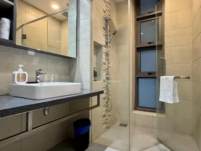 a bathroom with a sink and a shower at Balcony Cityscape V The Robertson Residence 36f in Kuala Lumpur