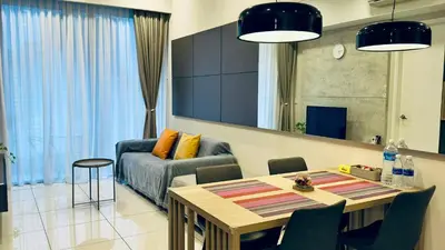a living room with a table and a couch at Balcony Cityscape V The Robertson Residence 36f in Kuala Lumpur
