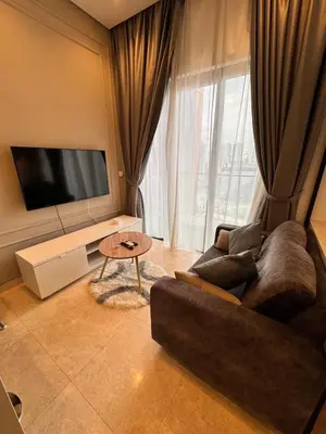 a living room with a couch and a large window at Lucentia residence by lalaport in Kuala Lumpur