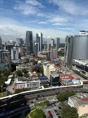 a city skyline with a highway and buildings at Ubays Majestic House in Kuala Lumpur