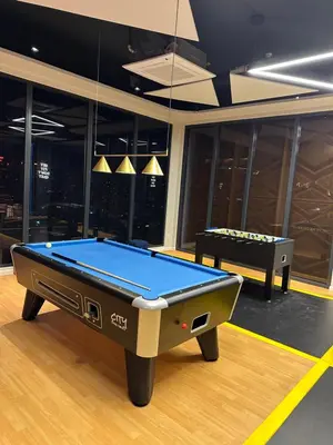 a pool table in the middle of a room at Ubays Majestic House in Kuala Lumpur